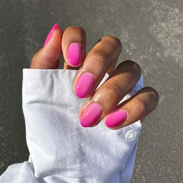 Pink nails are more subdued than red nails but can be just as head-turning. Here, find over a dozen romantic, flirty, and fun pink nail designs to try in the months ahead.