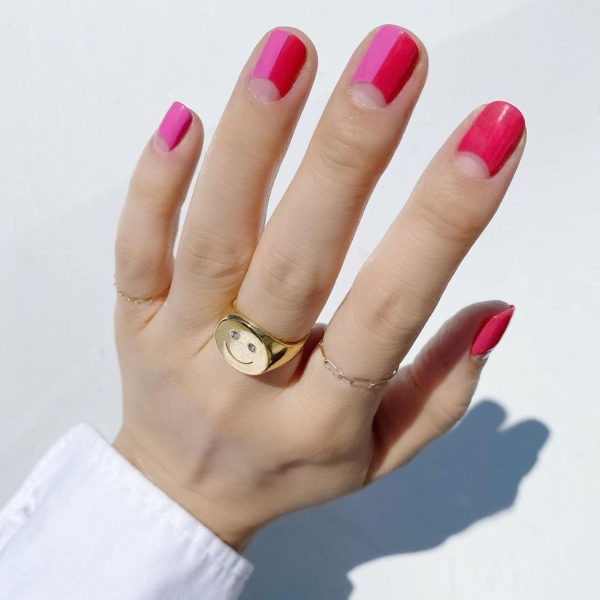 Pink nails are more subdued than red nails but can be just as head-turning. Here, find over a dozen romantic, flirty, and fun pink nail designs to try in the months ahead.