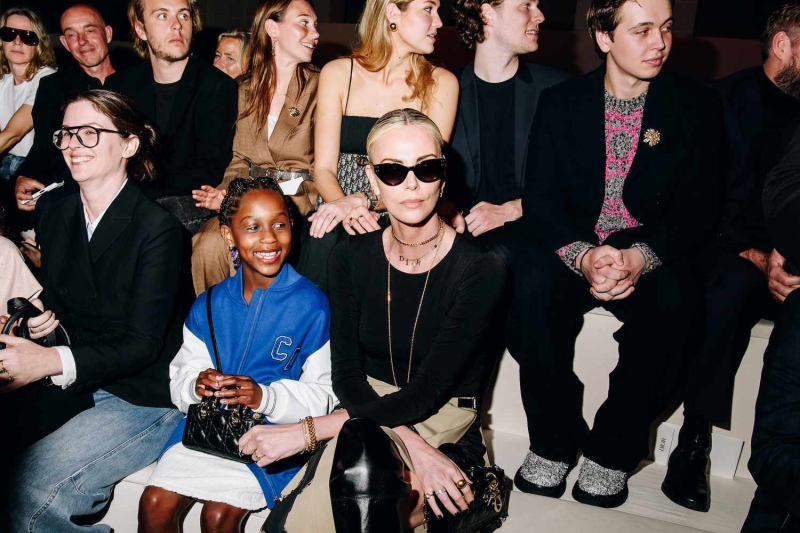 Charlize Theron and her daughter, August, sat front row at the Dior presentation in New York. See photos of the duo, here.