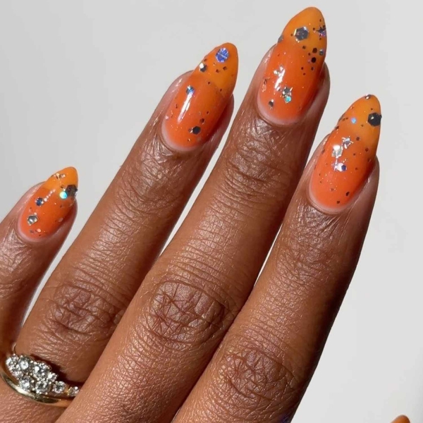 Orange nails aren't as common as, say, pink or red nails. The color shouldn't be overlooked, though. Here, find over a dozen bright and sunny orange nail designs perfect for spring and beyond.