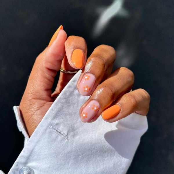 Orange nails aren't as common as, say, pink or red nails. The color shouldn't be overlooked, though. Here, find over a dozen bright and sunny orange nail designs perfect for spring and beyond.