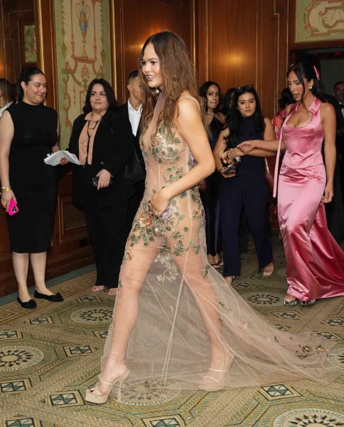 Although Chrissy Teigen skipped the 2024 Met Gala, she made sure to indulge in the "Garden of Time" dress code the next day at the ACE Awards. She wowed in a naked dress adorned with strategically placed floral details.