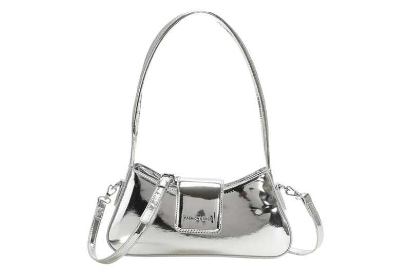 Dua Lipa carried a Jennifer Lopez-inspired silver metallic Gucci Horsebit Chain Shoulder Bag in New York City. Shop similar glitzy purses at Amazon, starting at $19.