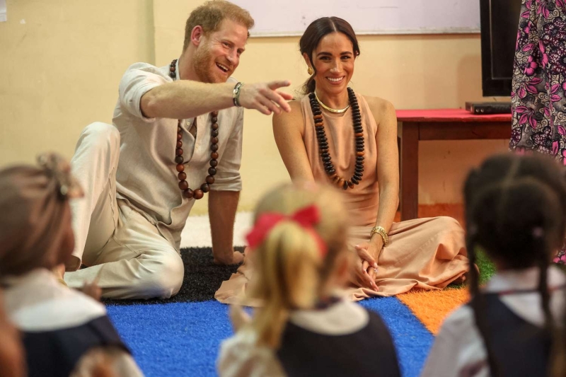 Meghan Markle's peach-colored maxi dress in Nigeria is called the "Windsor"—and the internet thinks it was a snub to the royal family.