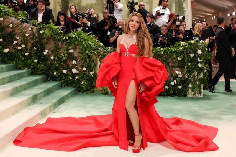 Shakira wore an ab-bearing white cut-out dress embellished with bows at a Met Gala after-party on Monday, May 6, just hours after making her Met Gala debut in a red Carolina Herrera gown with a matching cape.