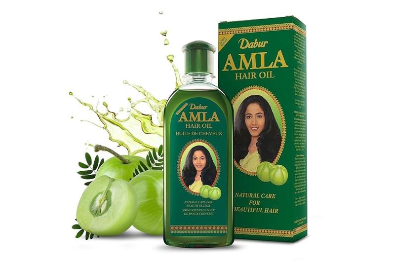 Amazon shoppers swear by the Dabur Amla Hair Oil for new hair growth, reduced hair shedding, and less breakage. The top-rated hair-growth treatment is available for just $10 on Amazon.