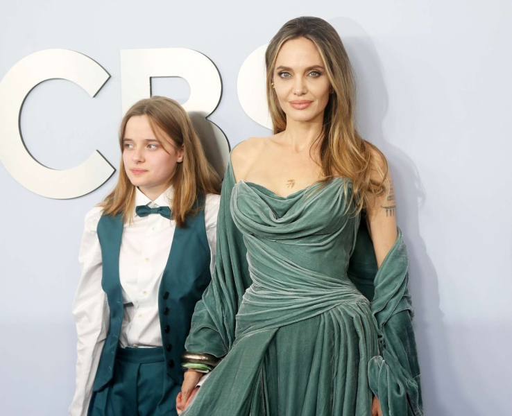 Angelina Jolie debuted a new chest tattoo of a bird at the Tony Awards, which she attended with her daughter Vivienne. Her new ink comes months after she showed off a tattoo inspired by her 15-year-old daughter at the opening night of 'The Outsiders' in April.