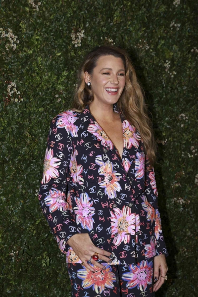 Blake Lively took inspiration from '70s flower power with a floral painted Chanel pajama suit while stepping out at the Tribeca Festival Artists Dinner on Monday, June 10. See the 'Gossip Girl' actress's outfit here.