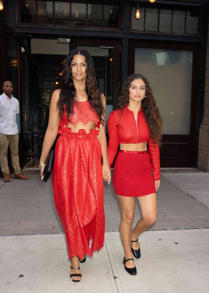 Camila Alves and her daughter, Vida, wore coordinating red outfits to the Hermes fashion show in New York City. See their looks, here.