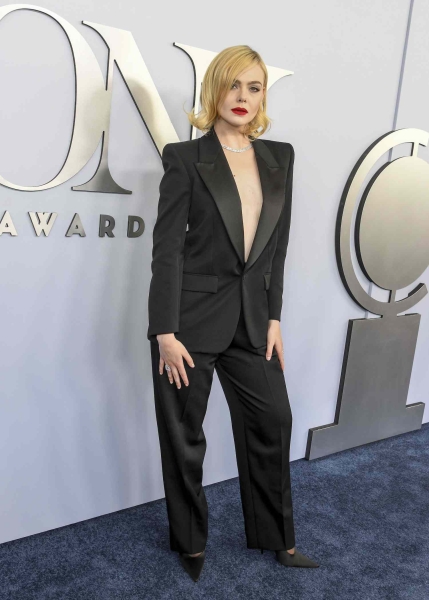 Elle Fanning wore a tuxedo look from Saint Laurent with no shirt underneath to the 2024 Tony Awards. See her Madonna- and Marlene Dietrich-inspired look, here.