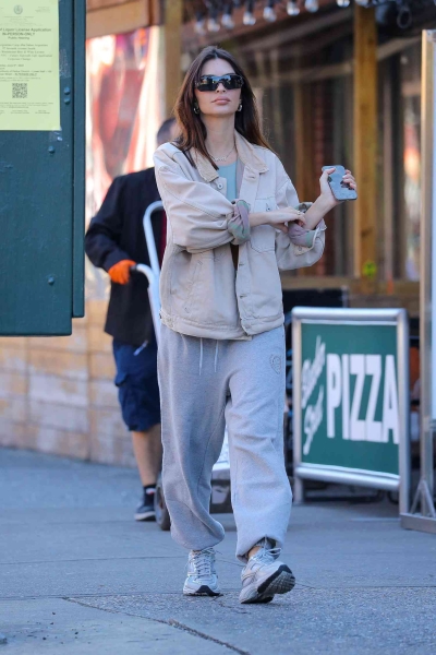 Emily Ratajkowski wore basketball shorts and a boxy white T-shirt. See her full look, reminiscent of Adam Sandler's signature style, here.