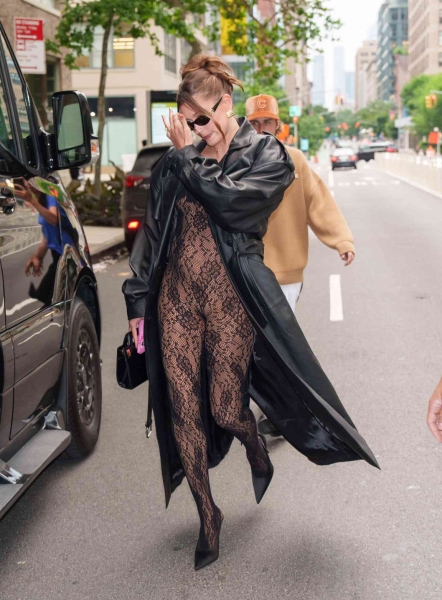 Hailey Bieber showed off her growing baby bump in a sheer lace bodysuit while stepping out for a date night in NYC with Justin Bieber on June 22. See the lingerie-inspired body-con maternity outfit.