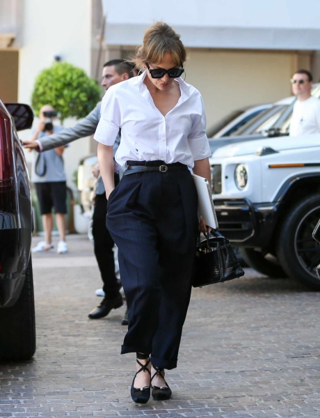 Jennifer Lopez stepped out in a pair of black pants and a white button-down shirt for a weekend meeting in Los Angeles. See her full look here.
