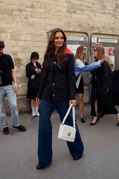 Katie Holmes was spotted outside the Patou Haute Couture fall-winter 2025 show in an all-American red, white, and blue outfit. See her full look here.