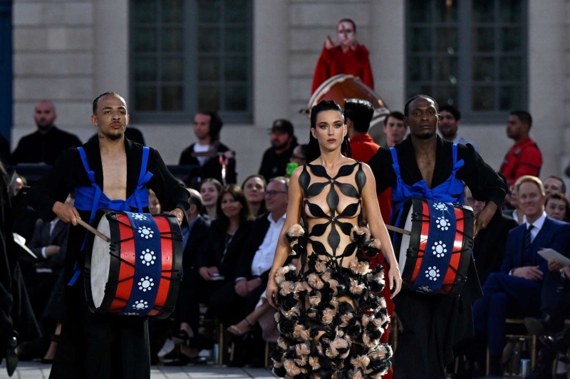 Katy Perry made a nearly-naked appearance at Vogue World: Paris on June 23, wearing a leather dress with giant cutouts. The singer stepped out on the runway in the daring barely-there design during the 1980s section of the event, which was inspired by martial arts.