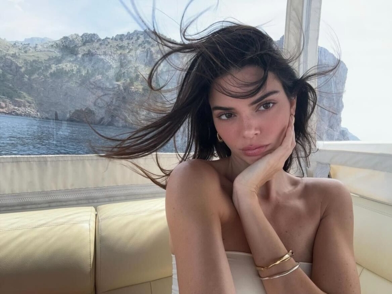 Kendall Jenner went braless in a sheer lilac dress from Khaite in an Instagram carousel shared on Monday, June 3. The model showed off angles of the $3,500 gown, which featured a see-through bodice and a flared skirt, while lounging on a yacht in Mallorca, Spain.