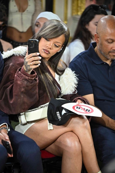 Rihanna showed her support at partner A$AP Rocky's debut fashion show during Paris Fashion Week while debuting a brand-new hairstyle in the front row.