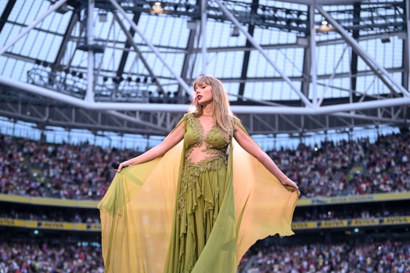 Taylor Swift kicked off her Eras Tour in Ireland with a sparkly green-and-orange two-piece set on Friday (June 29). See her look from every angle here.