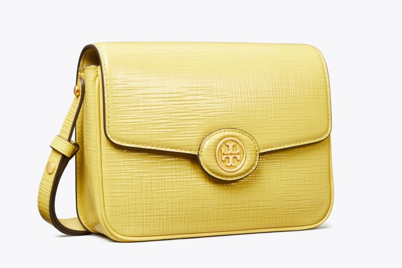 Tory Burch is offering up to 62 percent off over hundreds of items, including summer-ready bags, sandals, sneakers, wallets, and accessories. A fashion editor's top 10 picks start at $45.