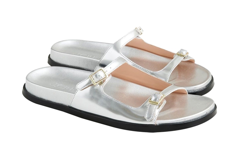 Vera Wang posted an Instagram photo wearing a white one-piece swimsuit and silver slingback sandals by the pool. Shop similar metallic summer sandals and white bathing suits from Amazon, Nordstrom, Zappos, and more.