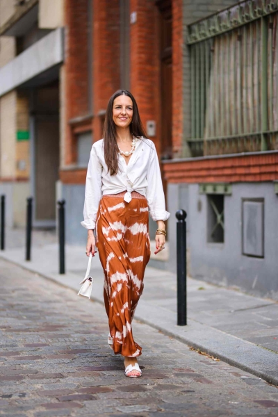 Whether it’s a graphic t-shirt or a blouse, creating an outfit to go with your skirt is easier than you think. Here you’ll find 10 skirt outfit ideas to step up your style game.