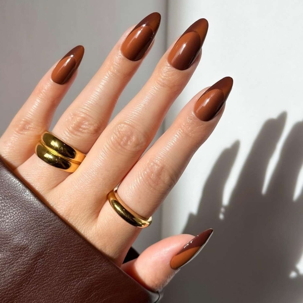 While classic pink and white French manis are making a comeback, brown French tip nails offer an updated take on the classic look. Here, find a dozen brown french tip nail looks for inspiration.