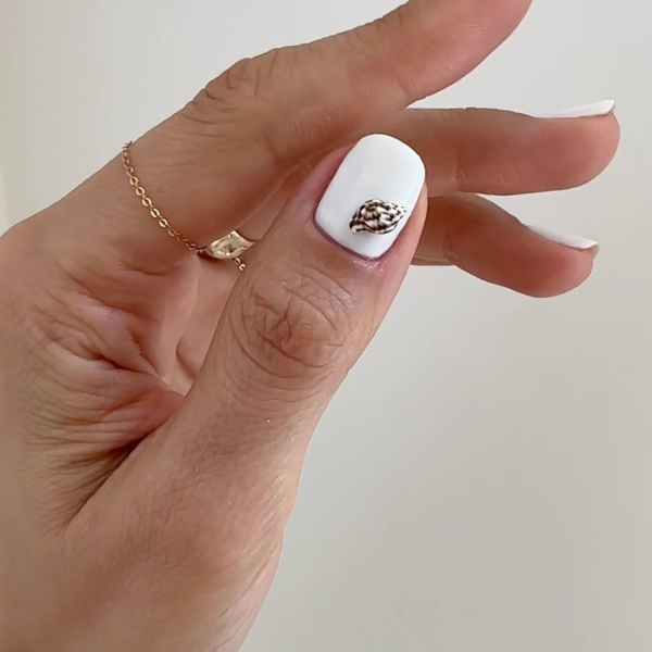 White nail polish is one of the most requested shades of summer, but it's a shade that can truly be worn year-round. Here, find over a dozen crisp short white nail looks to brighten up your manicure.