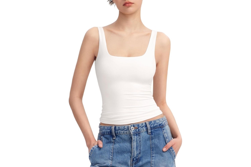 Blake Lively and Kendall Jenner have been wearing flattering white tank tops nonstop, so much so that I’m officially deeming it summer 2024’s hero basic. Shop easy going white tank tops to wear nonstop this season from Good American, Reformation, Madewell, and more.