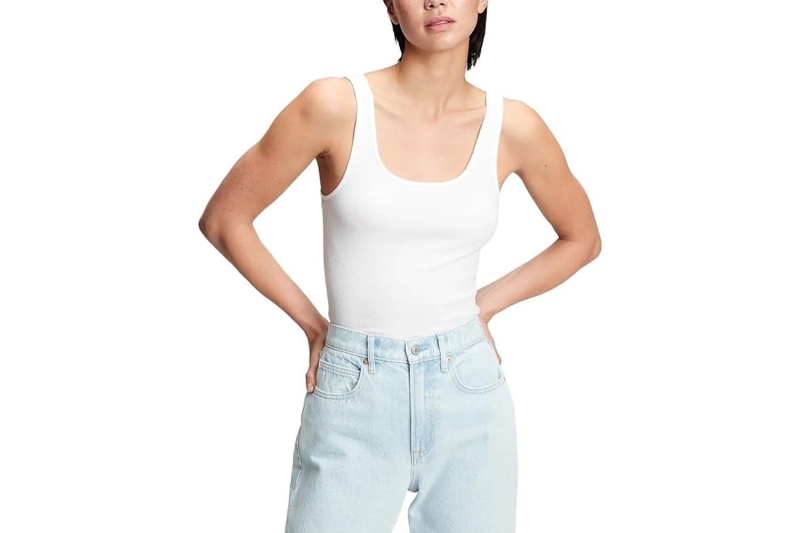 Blake Lively and Kendall Jenner have been wearing flattering white tank tops nonstop, so much so that I’m officially deeming it summer 2024’s hero basic. Shop easy going white tank tops to wear nonstop this season from Good American, Reformation, Madewell, and more.