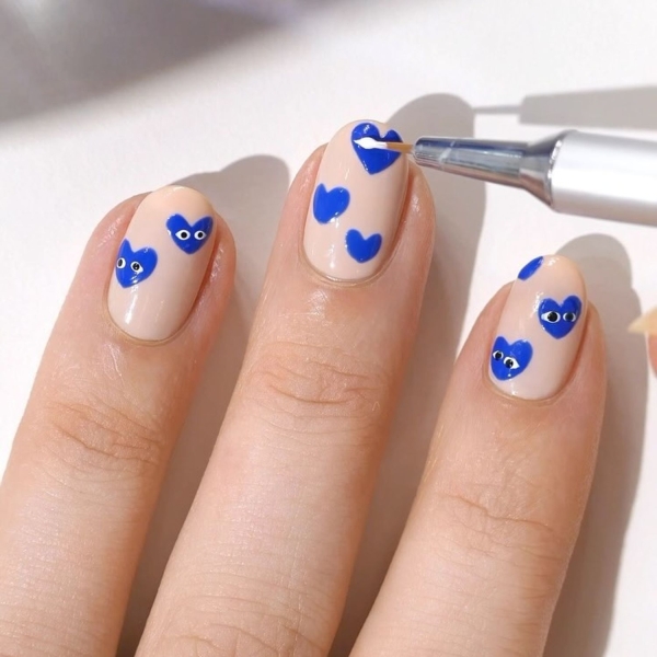 Blue nail designs are popular year-round for their fresh and cool vibe. Here, discover 20 blue nail designs to recreate at home with tips from pro nail artists.