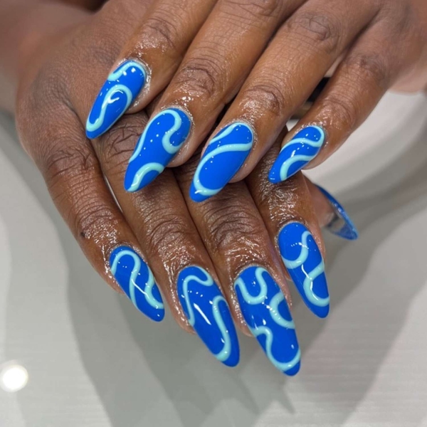 Blue nail designs are popular year-round for their fresh and cool vibe. Here, discover 20 blue nail designs to recreate at home with tips from pro nail artists.