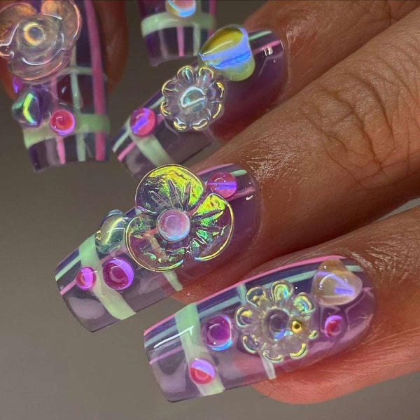 From raised petals to metallic decals, there are lots of ways to achieve 3D flower nail designs. Scroll through 16 jaw-dropping designs to inspire your next manicure.