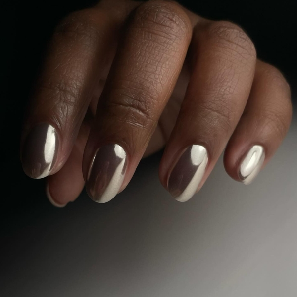 Hailey Bieber's chrome nails seem to never go out of style. Celebrity nail artists Sashanie Gray and Rachel Messick share everything you need to know about chrome nails and 15 of their favorite designs.