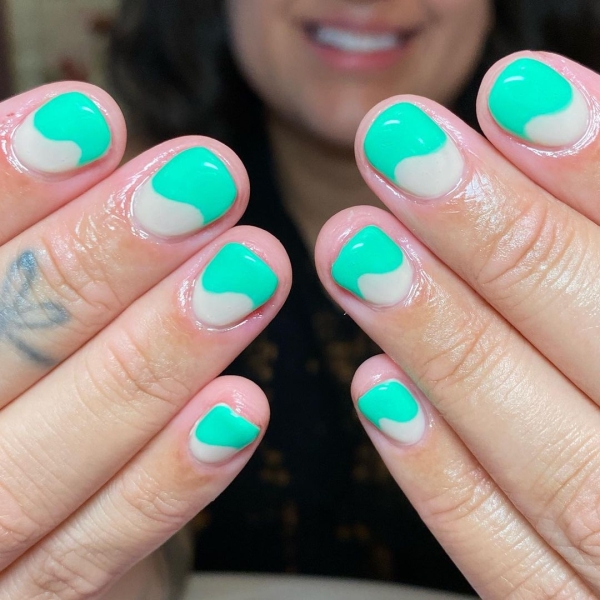 It's undeniable: Green is the color of the moment. Whether you want to go full neon or more muted, here are 18 short green nail looks to inspire your next manicure.