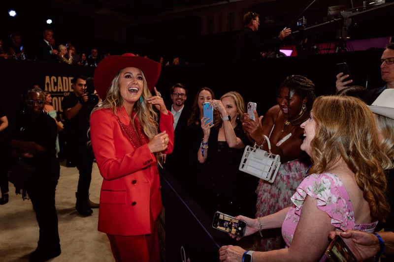 Lainey Wilson gave InStyle an exclusive look behind the scenes as she got ready for the 2024 ACM Awards, where she took home three awards. See her glam process, details on her chic Area suit, the story behind her Kendra Scott jewelry, and more.