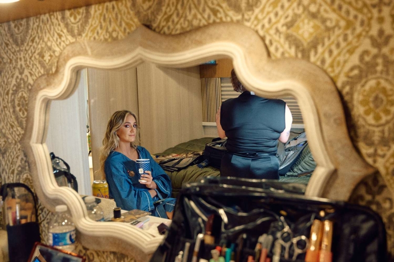 Lainey Wilson gave InStyle an exclusive look behind the scenes as she got ready for the 2024 ACM Awards, where she took home three awards. See her glam process, details on her chic Area suit, the story behind her Kendra Scott jewelry, and more.