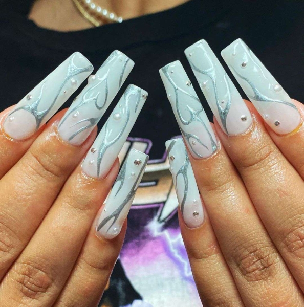 Metallic nails offer an easy way to create a bold look that functions like jewelry — you can wear them seamlessly with any outfit.