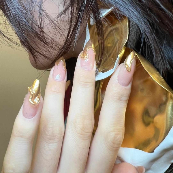 Metallic nails offer an easy way to create a bold look that functions like jewelry — you can wear them seamlessly with any outfit.