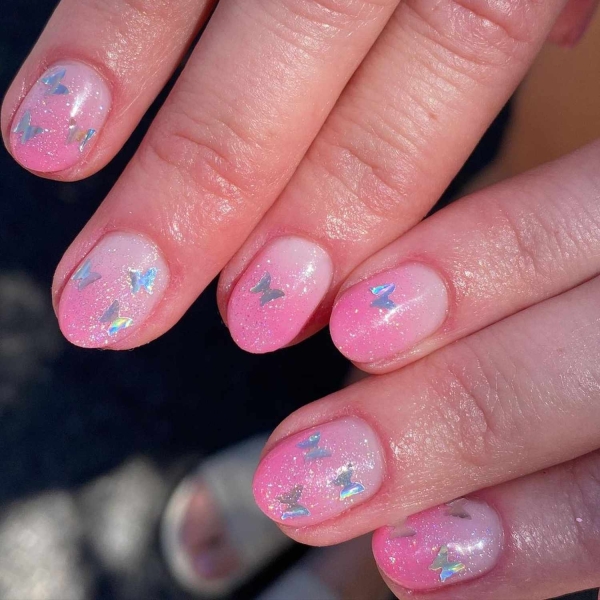 Pink ombre nails are trending for summer 2024. Here, explore our favorite pink ombre nail designs.