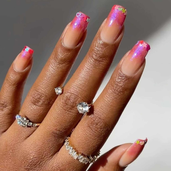 Pink ombre nails are trending for summer 2024. Here, explore our favorite pink ombre nail designs.