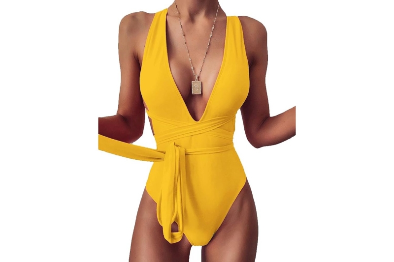 Selena Gomez sizzled in a waist-cinching one-piece swimsuit that featured boob-baring sides and a low back with cheeky bottoms. Shop similar sexy styles on Amazon, starting at $23.