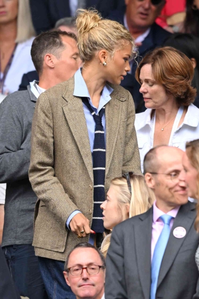 Zendaya made a surprise appearance at Wimbledon on Saturday, July 13 in an outfit that looked straight out of 'Challengers.' The tenniscore look included a menswear-inspired blazer from Ralph Lauren and a knit tie.