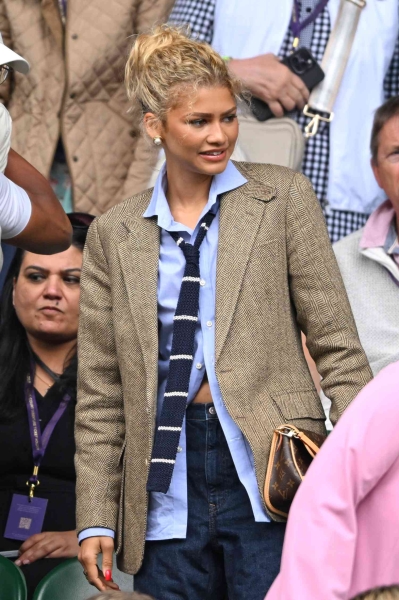 Zendaya made a surprise appearance at Wimbledon on Saturday, July 13 in an outfit that looked straight out of 'Challengers.' The tenniscore look included a menswear-inspired blazer from Ralph Lauren and a knit tie.