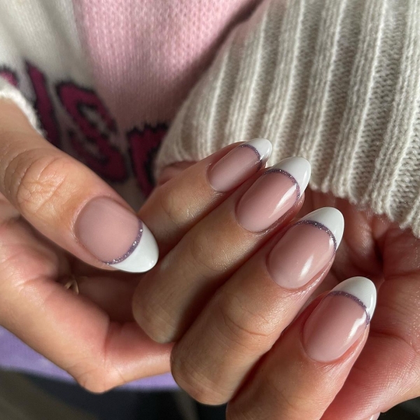 A French manicure is timeless, but a seasonal twist on the neutral look is always welcome. Come winter, cool metallics and warm, jewel-toned hues are extra fitting. Here are 10 seasonal variations to try.