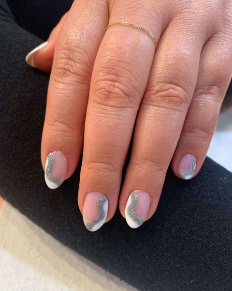 A French manicure is timeless, but a seasonal twist on the neutral look is always welcome. Come winter, cool metallics and warm, jewel-toned hues are extra fitting. Here are 10 seasonal variations to try.