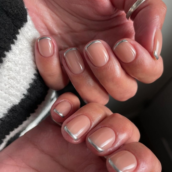 A French manicure is timeless, but a seasonal twist on the neutral look is always welcome. Come winter, cool metallics and warm, jewel-toned hues are extra fitting. Here are 10 seasonal variations to try.