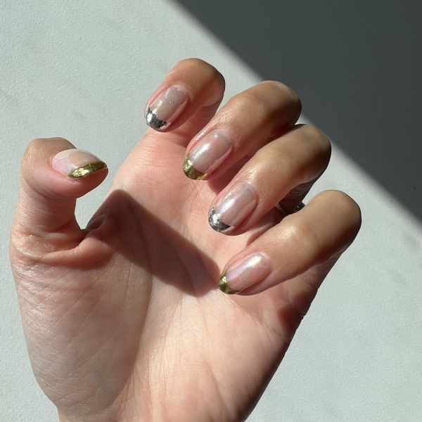 A French manicure is timeless, but a seasonal twist on the neutral look is always welcome. Come winter, cool metallics and warm, jewel-toned hues are extra fitting. Here are 10 seasonal variations to try.