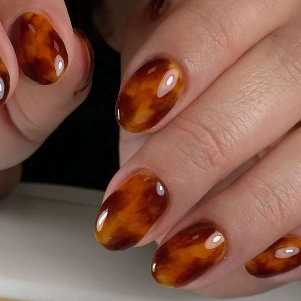 Autumn tones, animal prints, and foliage details are the easiest way to elevate manicures for the November. Here, explore over a dozen November nail ideas.