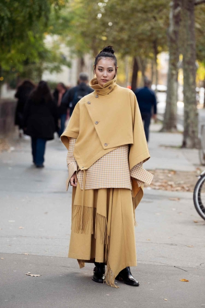 Believe it or not, a cape can be quite versatile outerwear: it's a chic topper that works at various lengths, in various materials, and with various base layer outfits. Here are a few ways to style the dramatic piece.