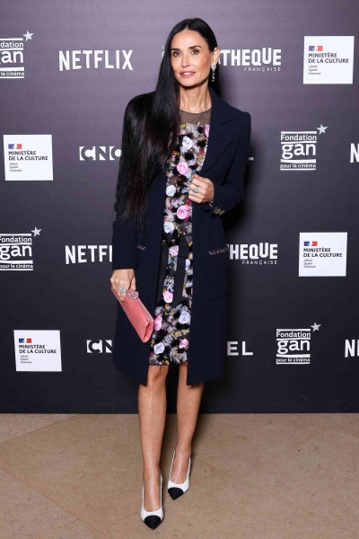 Demi Moore appeared at the French premiere of 'The Substance' wearing a floral look that broke seasonal fashion rules and veered away from her signature menswear-inspired style.